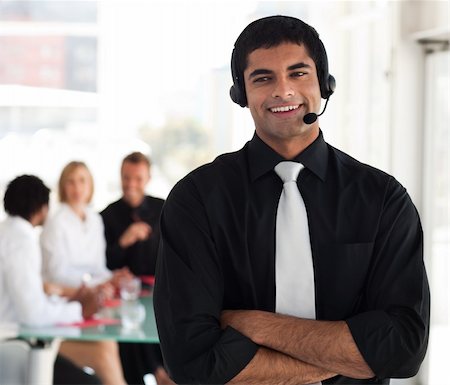 simsearch:400-03933798,k - Professional looking businessman witha headset on Stock Photo - Budget Royalty-Free & Subscription, Code: 400-04111022