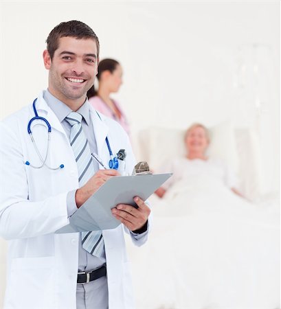 Team of Doctors Looking after a senior Patient Stock Photo - Budget Royalty-Free & Subscription, Code: 400-04112105