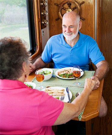 simsearch:400-04208630,k - Senior couple enjoys conversation over a healthy meal in their motor home. Stock Photo - Budget Royalty-Free & Subscription, Code: 400-04124571