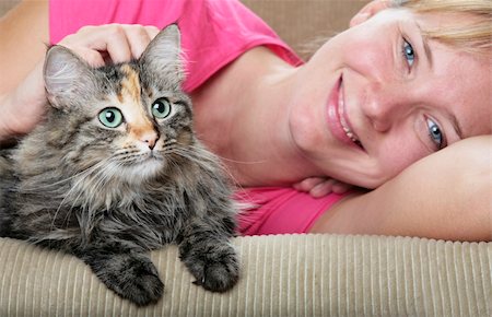 spanishalex (artist) - Pretty girl and cute cat on the sofa Stock Photo - Budget Royalty-Free & Subscription, Code: 400-04125321