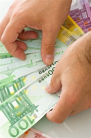 simsearch:400-04011910,k - Euro banknotes in a man's hand Stock Photo - Budget Royalty-Free & Subscription, Code: 400-04125671