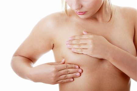 self breast exam - Young Caucasian adult woman examining her breast for lumps or signs of breast cancer Stock Photo - Budget Royalty-Free & Subscription, Code: 400-04125730