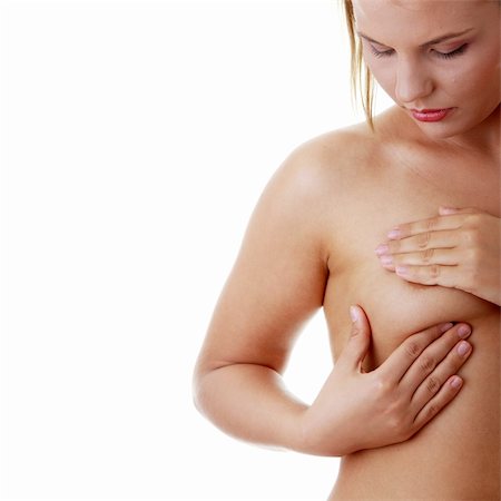 self breast exam - Young Caucasian adult woman examining her breast for lumps or signs of breast cancer Stock Photo - Budget Royalty-Free & Subscription, Code: 400-04125733
