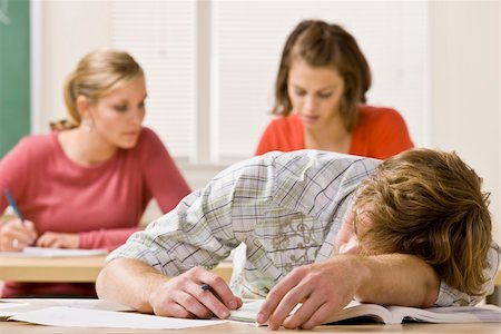 Student sleeping at desk in classroom Stock Photo - Budget Royalty-Free & Subscription, Code: 400-04128959