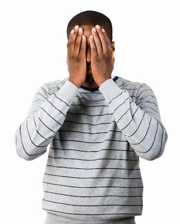 simsearch:400-04918265,k - Young man covering his face in despair Stock Photo - Budget Royalty-Free & Subscription, Code: 400-04129974