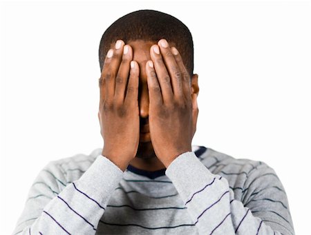 simsearch:400-04918265,k - Young man covering his face in despair Stock Photo - Budget Royalty-Free & Subscription, Code: 400-04129975