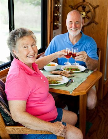 simsearch:400-04208630,k - Senior couple enjoys a romantic meal in the kitchen of their motor home. Stock Photo - Budget Royalty-Free & Subscription, Code: 400-04120997