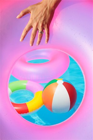 spanishalex (artist) - Inflatable toys seen through a rubber ring Stock Photo - Budget Royalty-Free & Subscription, Code: 400-04122392