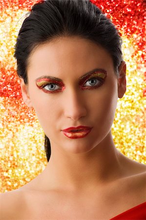 simsearch:400-05895838,k - Portrait of a beautiful woman with artistic red and goden make-up on her face Foto de stock - Super Valor sin royalties y Suscripción, Código: 400-04135105