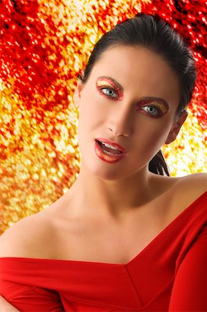 simsearch:400-05895838,k - nice portrait of young woman with shining golden make up and a red top Foto de stock - Super Valor sin royalties y Suscripción, Código: 400-04135101