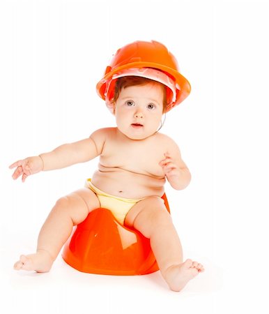 Baby in hardhat sitting on the potty Stock Photo - Budget Royalty-Free & Subscription, Code: 400-04136816