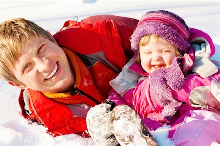 Happy father and daughter playing in snow Stock Photo - Budget Royalty-Free & Subscription, Code: 400-04136826