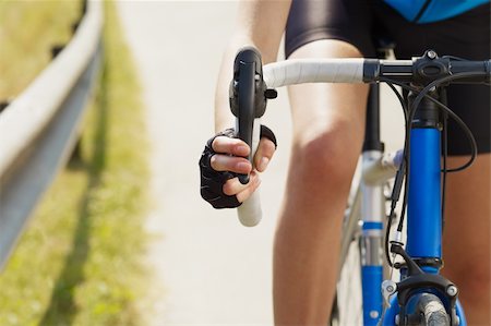 Cropped view of female cyclist with hands on brakes. Copy space Stock Photo - Budget Royalty-Free & Subscription, Code: 400-04138352