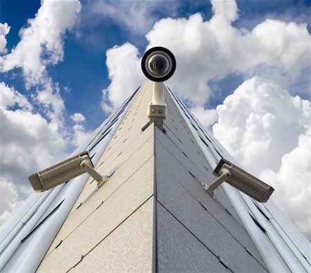 Three security cameras opposite the sky Stock Photo - Budget Royalty-Free & Subscription, Code: 400-04130150