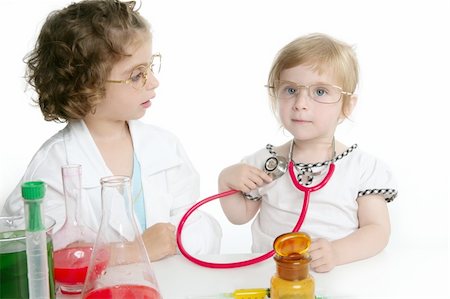 simsearch:400-07411030,k - Two girls pretending to be doctor in the laboratory Stock Photo - Budget Royalty-Free & Subscription, Code: 400-04130386