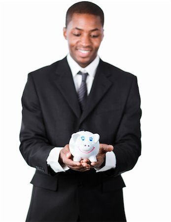 simsearch:400-05715207,k - Portrait of an handsome American businessman holding a piggy bank with focus on piggy bank Stock Photo - Budget Royalty-Free & Subscription, Code: 400-04130696