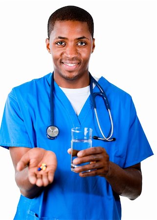 Young Afro-American doctor in scrubs with pills and glass of water smiling at the camera Stock Photo - Budget Royalty-Free & Subscription, Code: 400-04130712