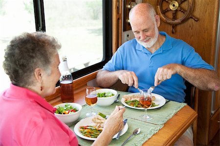 simsearch:400-04208630,k - Senior couple enjoys a healthy meal in the kitchen of their RV. Stock Photo - Budget Royalty-Free & Subscription, Code: 400-04131219