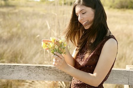 simsearch:400-04399510,k - Beautiful woman in golden outdoor with yellow flower Stock Photo - Budget Royalty-Free & Subscription, Code: 400-04132200