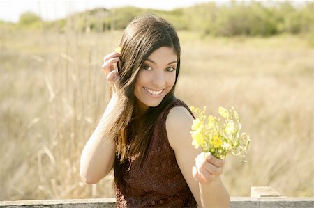 simsearch:400-04399510,k - Beautiful woman in golden outdoor with yellow flower Stock Photo - Budget Royalty-Free & Subscription, Code: 400-04132201