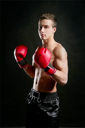 simsearch:400-04970057,k - Young  shaped man boxing, isolated studio shot Stock Photo - Budget Royalty-Free & Subscription, Code: 400-04132491