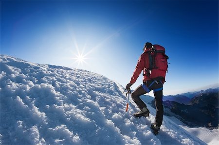 simsearch:400-05118687,k - A lone mountaineer reach the top of a high mountain peak. Monte Rosa, Swiss. Stock Photo - Budget Royalty-Free & Subscription, Code: 400-04144368