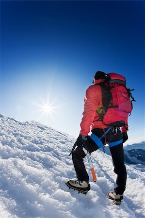 simsearch:400-05118687,k - A lone mountaineer reaches the top of a high mountain peak. Monte Rosa, Swiss. Stock Photo - Budget Royalty-Free & Subscription, Code: 400-04144369