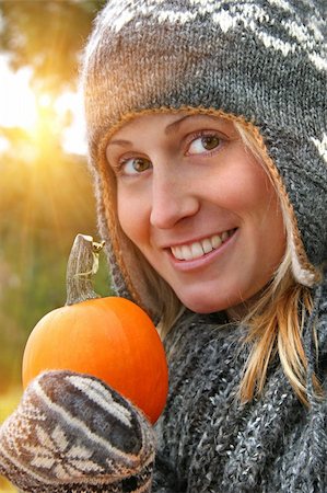 Young woman holding a pumpkin on an autumn day Stock Photo - Budget Royalty-Free & Subscription, Code: 400-04145797