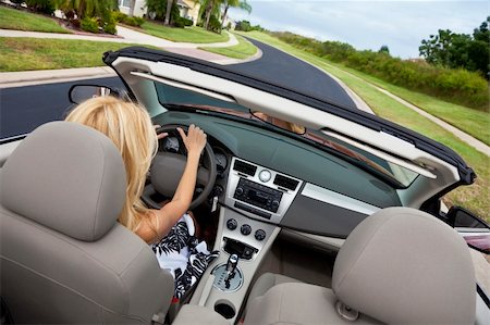 Rear view of a beautiful young blond woman driving her convertible car Stock Photo - Budget Royalty-Free & Subscription, Code: 400-04149734