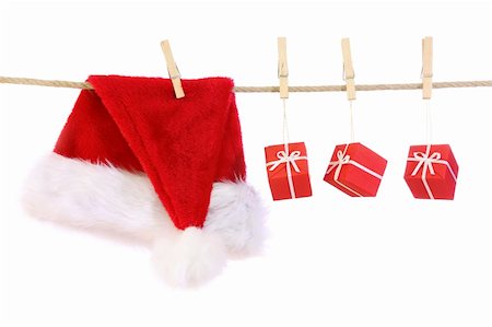 simsearch:400-04149556,k - Santa claus hat and presents isolated on white background Stock Photo - Budget Royalty-Free & Subscription, Code: 400-04141247