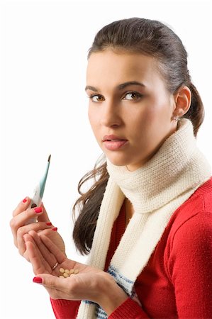 simsearch:400-05716904,k - cute brunette in red pullover and white scarf with thermometer and pills looking sick Stock Photo - Budget Royalty-Free & Subscription, Code: 400-04142087