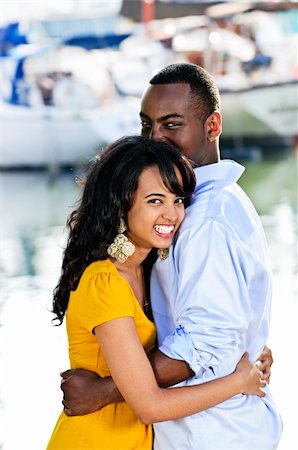 Young romantic couple hugging and standing at harbor Stock Photo - Budget Royalty-Free & Subscription, Code: 400-04155046