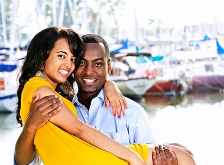 Portrait of man carrying his girlfriend standing at harbor Stock Photo - Budget Royalty-Free & Subscription, Code: 400-04155052
