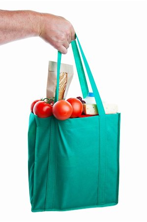 simsearch:400-04605857,k - A strong hand holding an environmentally friendly bag full of groceries.  Shot on white background. Stock Photo - Budget Royalty-Free & Subscription, Code: 400-04155595