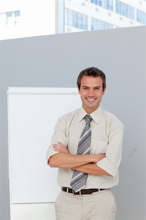 simsearch:400-05710386,k - Confident businessman giving a presentation in the office Stock Photo - Budget Royalty-Free & Subscription, Code: 400-04156445