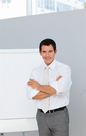simsearch:400-05710386,k - Attractive businessman reporting to sales figures in the office Stock Photo - Budget Royalty-Free & Subscription, Code: 400-04156448
