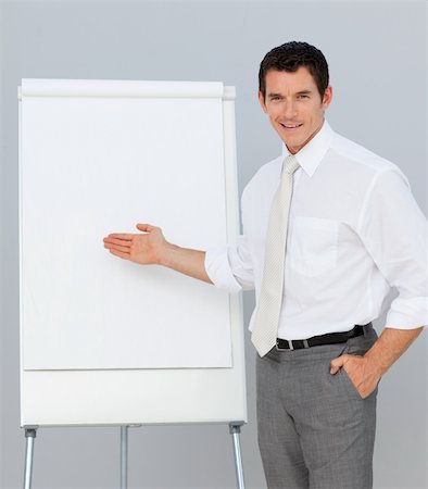 simsearch:400-05710386,k - Confident businessman giving a presentation in the office Stock Photo - Budget Royalty-Free & Subscription, Code: 400-04156449