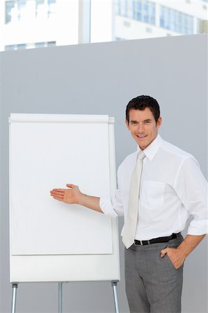 simsearch:400-05710386,k - Attractive businessman giving a presentation in the office Stock Photo - Budget Royalty-Free & Subscription, Code: 400-04156450