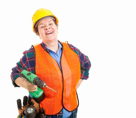 plumber (female) - Female construction worker happy and smiling, holding her power drill.  Isolated on white. Stock Photo - Budget Royalty-Free & Subscription, Code: 400-04156988