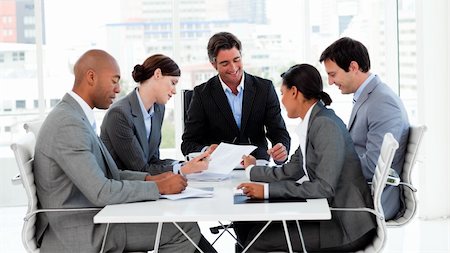 Confident manager in a meeting with his team Stock Photo - Budget Royalty-Free & Subscription, Code: 400-04157272