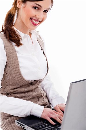 simsearch:400-04158321,k - Cute girl typing on laptop on a white isolated background Stock Photo - Budget Royalty-Free & Subscription, Code: 400-04158266