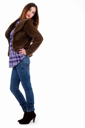 simsearch:400-04158321,k - Pretty model posing wearing blue jean, matching top and a fur coat indoor studio Stock Photo - Budget Royalty-Free & Subscription, Code: 400-04158295