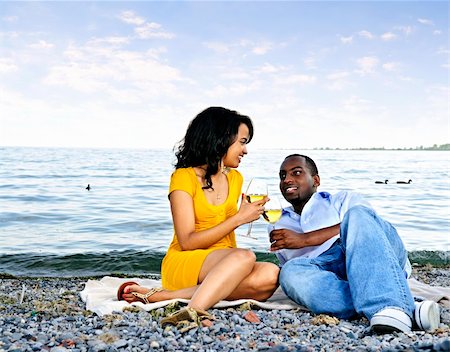 Young romantic couple celebrating with wine at the beach looking at each other Stock Photo - Budget Royalty-Free & Subscription, Code: 400-04158554
