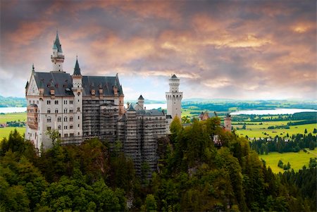 fantasy european castles - Castle Neuschwanstein at sunset with dramtic sky Stock Photo - Budget Royalty-Free & Subscription, Code: 400-04158924