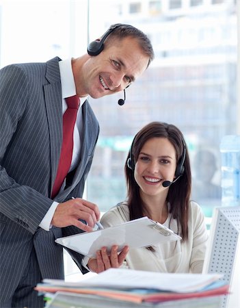 Manager working with a beautiful businesswoman in a call center Stock Photo - Budget Royalty-Free & Subscription, Code: 400-04150248