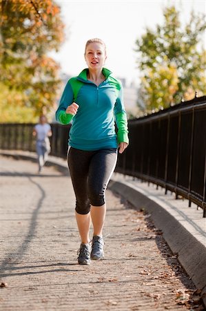 A woman jogging in a park Stock Photo - Budget Royalty-Free & Subscription, Code: 400-04150705