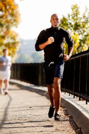 An African American jogging in a park in the morning Stock Photo - Budget Royalty-Free & Subscription, Code: 400-04150706