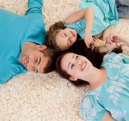 simsearch:400-04654755,k - Happy young family on floor with heads together Foto de stock - Super Valor sin royalties y Suscripción, Código: 400-04151195