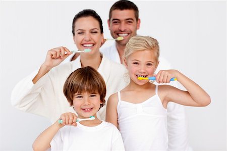 simsearch:400-04151135,k - Happy family cleaning their teeth in bathroom Stock Photo - Budget Royalty-Free & Subscription, Code: 400-04152030