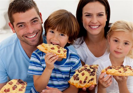 simsearch:400-04193348,k - Portrait of happy family eating pizza in living-room all together Stock Photo - Budget Royalty-Free & Subscription, Code: 400-04152232